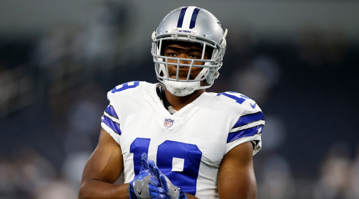 Amari Cooper stands on the field.